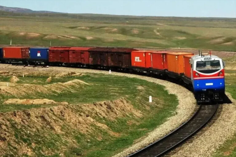 Eurasian Rail and Digital Silk Roads symbolized by a freight train crossing the Kazakh steppe
